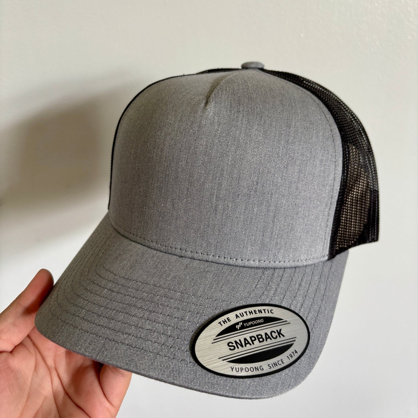 Hat with engraved patch